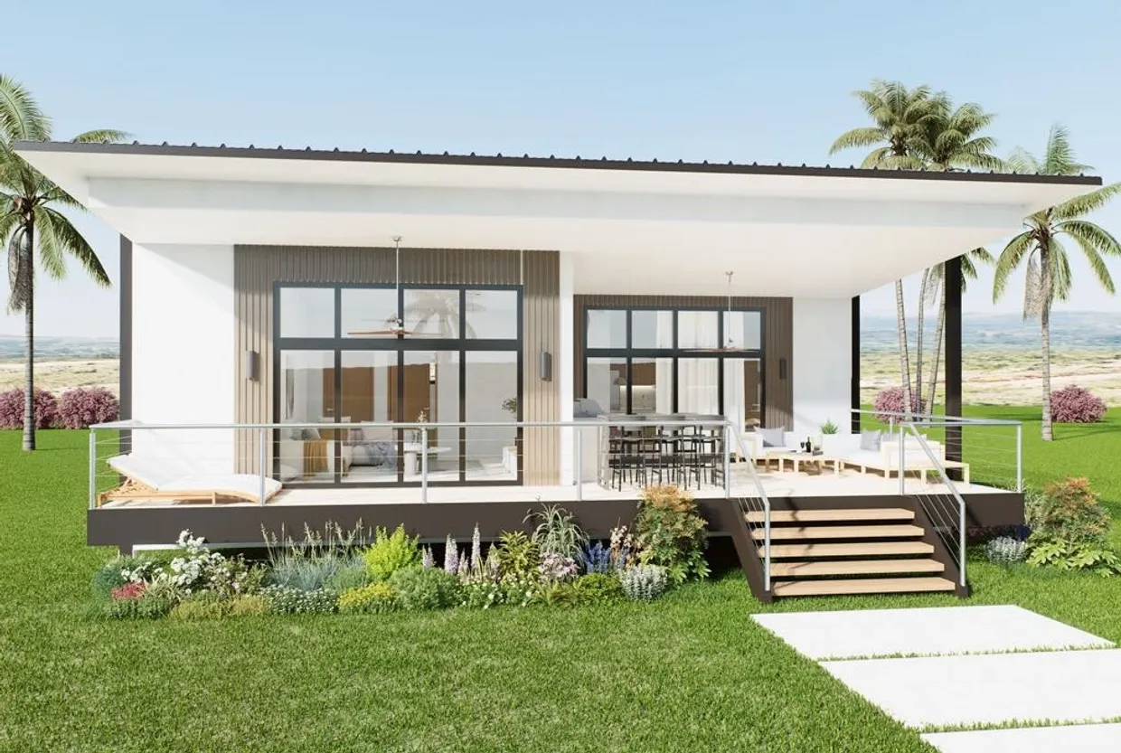 Modern single-story house with large windows and a spacious porch with outdoor seating.