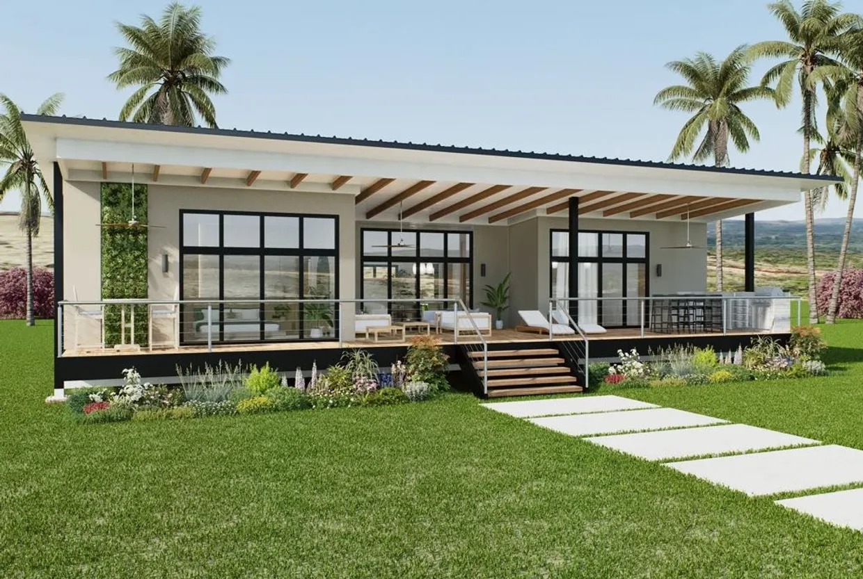 Maison moderne avec terrasse spacieuse et jardin verdoyant.